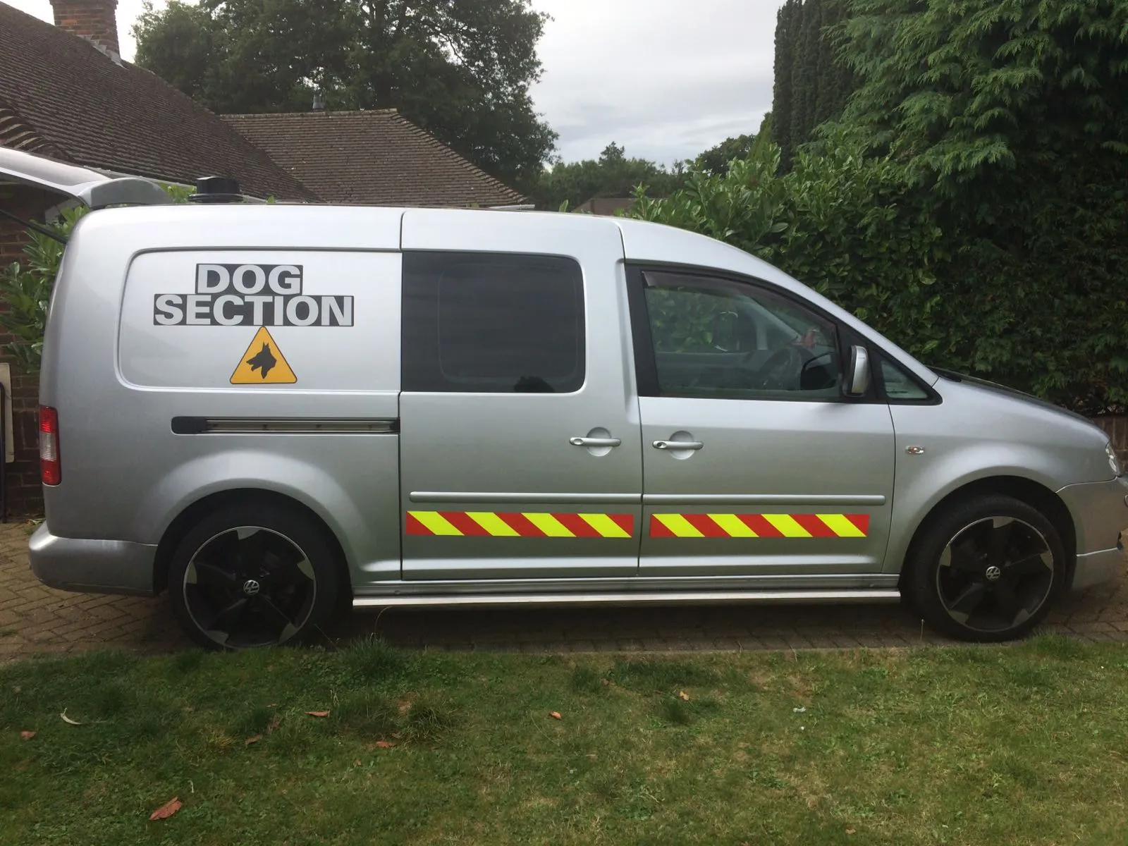 Silver dog section patrol van parked on a driveway